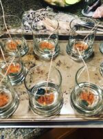 Large Mars candles, pre-pour. Each one features Mars powder and a bloodstone arrowhead