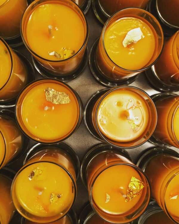 The top of Regulus candles, featuring 24k gold leaf